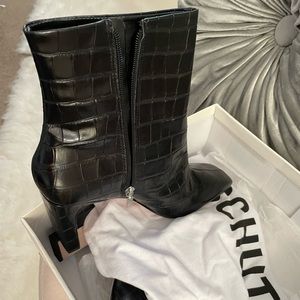 Boots never worn purchased from Saks Fifth Avenue, dress up or down brand new.